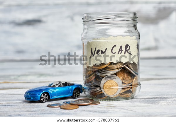 Toy car,\
money and card. Savings for buying new\
car.
