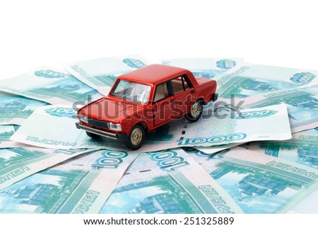 Toy car on the background of banknotes.
