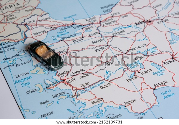 Toy\
car on Turkey map, miniature green sport car on Aegean Region, side\
view, Turkey travel concept, map idea, country\
tour
