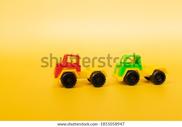 Close​ up​ toy car on
yellow background