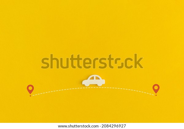 Toy car\
on a yellow background. Top view. Flat\
lay.