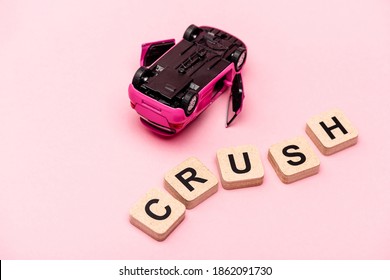 Toy Car And Word Crush On Cubes On Pink Background