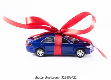 Toy Car Wrapped In A Red Ribbon