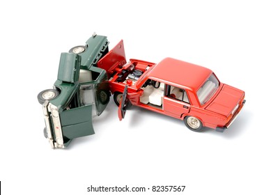 Toy Cars In Accident On A White Background