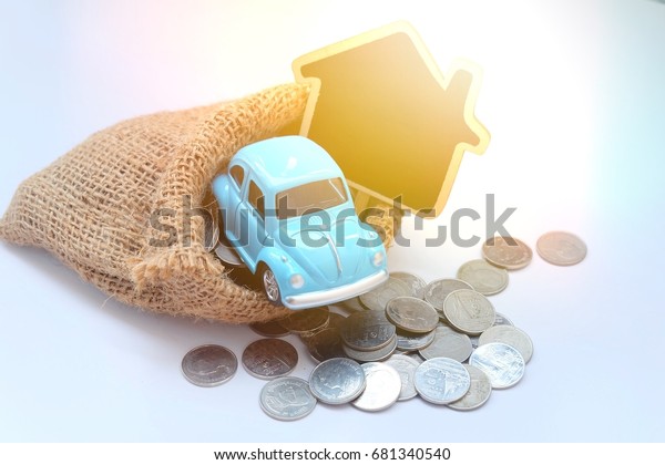 Toy
cars and composing artificial light.saving money to buy a car and
home. The cost incurred to have a home with a
car.