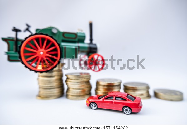 Toy cars with gold coins show To growth, saving
money for car loans.