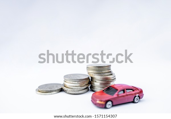 Toy cars with gold coins show To growth, saving\
money for car loans.