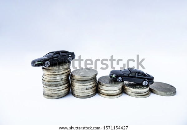 Toy cars with gold coins show To growth, saving\
money for car loans.