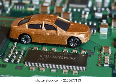 Toy Cars On Electronic Board And Microchip. Conceptual Image For Semiconductor Shortage Disrupting Production Of The Automotive Industry.
