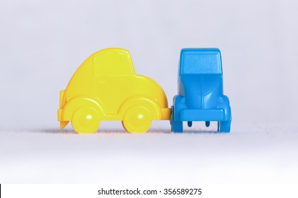 Toy Cars In A Row Isolated On White Background, Accident