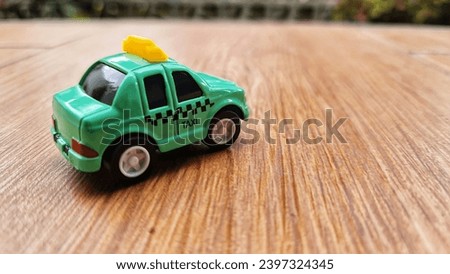 Toy cars in the shape of a green TAXI. Suitable for boys. Die cast car miniature.