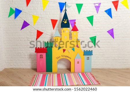 Toy castle backdrop for a photo shoot for a birthday. Photo zone with decorations for the birthday celebration for kids. Children's photo Studio for kids. Cardboard colorful children's castle