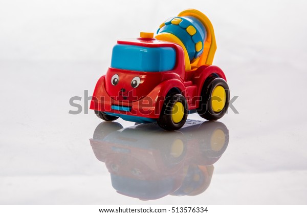 Toy concrete\
car isolated on a white\
background