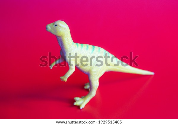 toy of dinosaur on red
back ground

