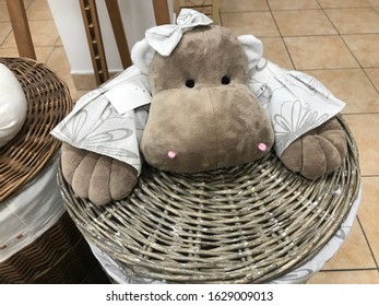 Toy dog objects are standing on wicker basket made of great composition. - Powered by Shutterstock