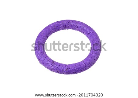 Toy for dogs purple puller. Animal training ring with teeth marks isolated on white background