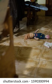 Toy Doll On The Floor Of An Indoor Untidy Lounge Room