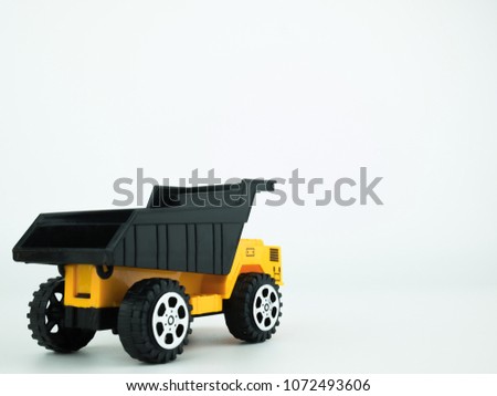 Toy Dump truck on white background, Engineering construction concept.