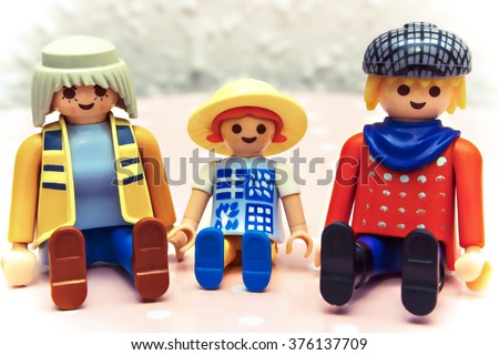 Toy family: mother, father and their child.