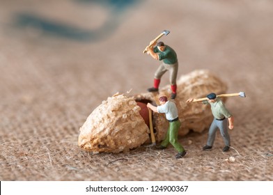 Toy figures of lumbermen with a peanut - Shutterstock ID 124900367
