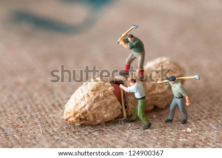 Toy figures of lumbermen with a peanut