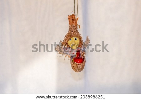 Toy flying witch or Baba Yaga in a hat and in a basket