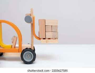 Toy Forklift. Business Concept. Front View