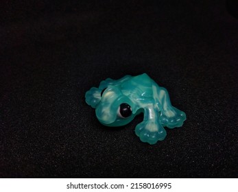 Toy Frog Photo On Black Background
