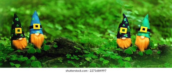 toy gnomes in forest, abstract green natural background. magic friends dwarfs in mystery nature. fairy tale image. spring, summer season. symbol of St. Patrick day, traditional irish holiday. banner.