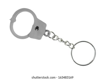 A Toy Handcuff Key Chain On A White Background.