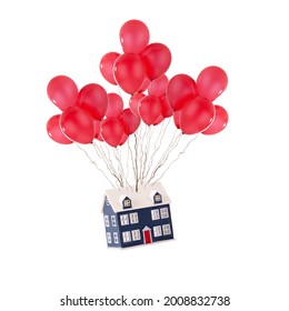 Toy house floating up with red balloons isolated on a white background. Moving house and new home concept for estate agents