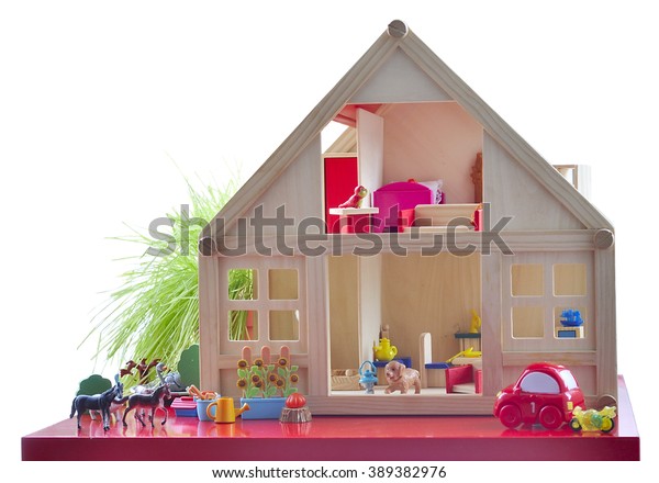 Toy house with\
furniture and animal\
figures