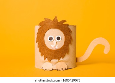 Toy Lion Made Of Toilet Paper Roll On Yellow Background