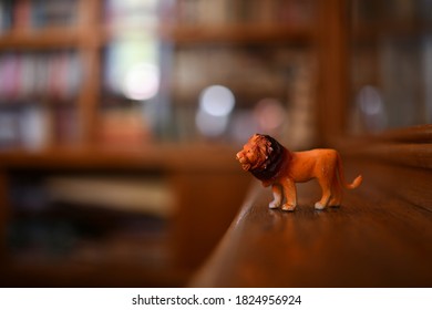 Toy Lion Standing On  A Dusty Shelf In An Old House.