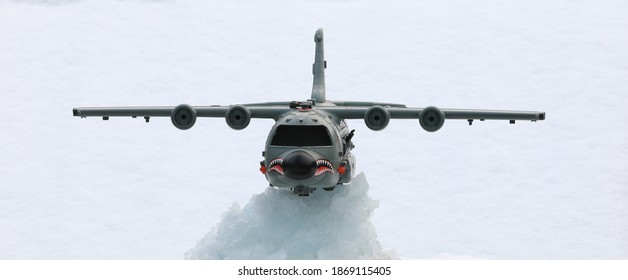 toy military plane in the snow