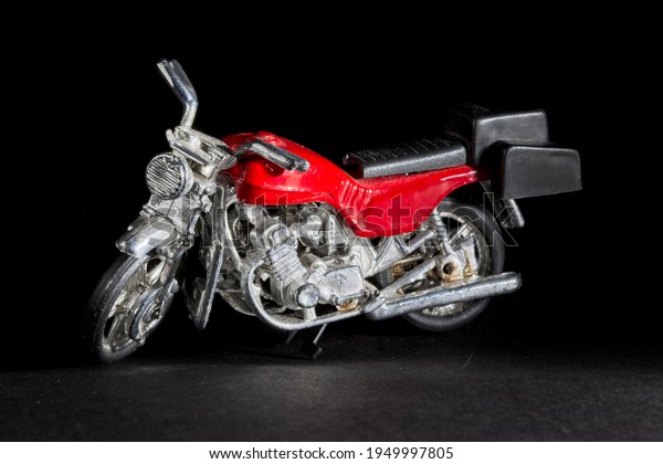 Toy Motorbike on a black\
background