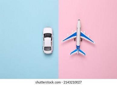 Toy Passenger Plane And Car On Blue Pink Background. Transport. Travel Concept. Top View. Flat Lay