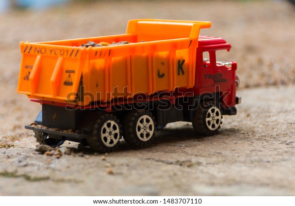Toy photography,\
isolated vehicle loaded