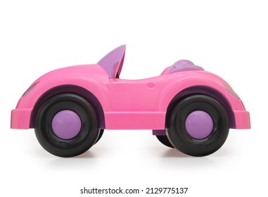 Toy pink plastic car. Isolated object.
