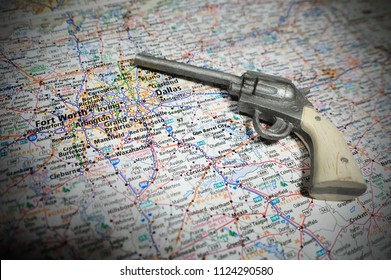 A Toy Pistol Pictured With A Map Of Dallas Fort Worth And Gun Barrel City, TX.