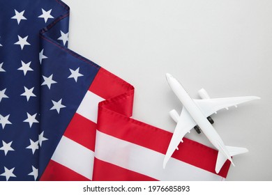 Toy Plane With American Flag On Grey Background. Top View