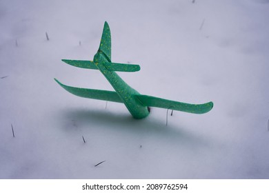 Toy Plane Crash In The Snow.