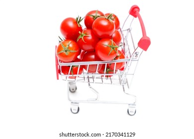 Toy Push Cart Full Of Fresh Cocktail Tomatoes Isolated On White Background.