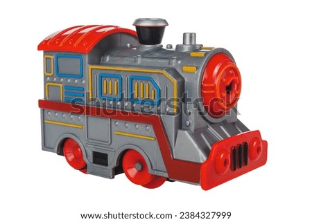 toy railroad with battery-powered steam locomotives and railway track, isolated on white background, close-up