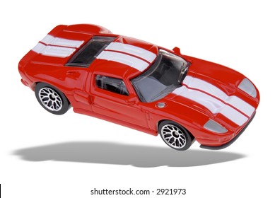 Toy Red Sports Car Isolated Over White With A Clipping Path