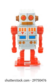 A Toy Robot Isolated Against A White Background