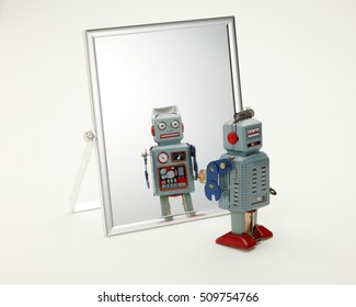 Toy Robot Looking In The Mirror