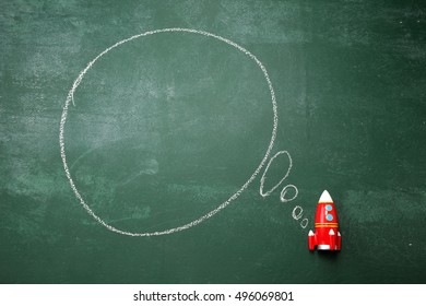 toy rocket with the thinking bubble bubble