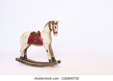 Toy rocking horse isolated on white background. Copy space.