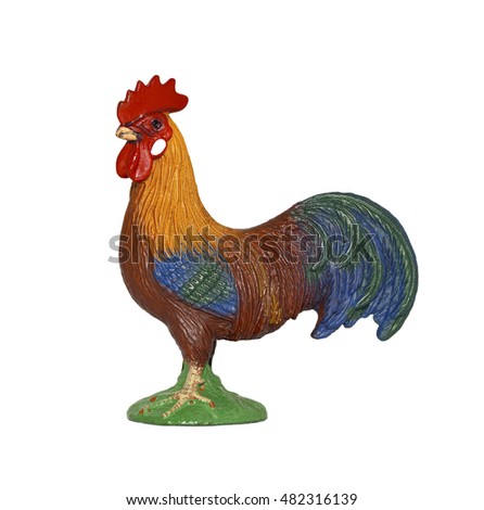 Toy rooster isolated on whiteBeautiful bright plastic toy rooster. Toy birds and animals on the farm - a toy rooster isolated on white. 